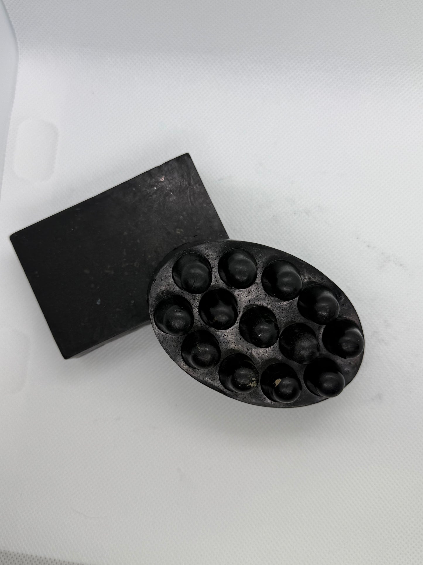 Exfoliating soap bar with a sandalwood scent