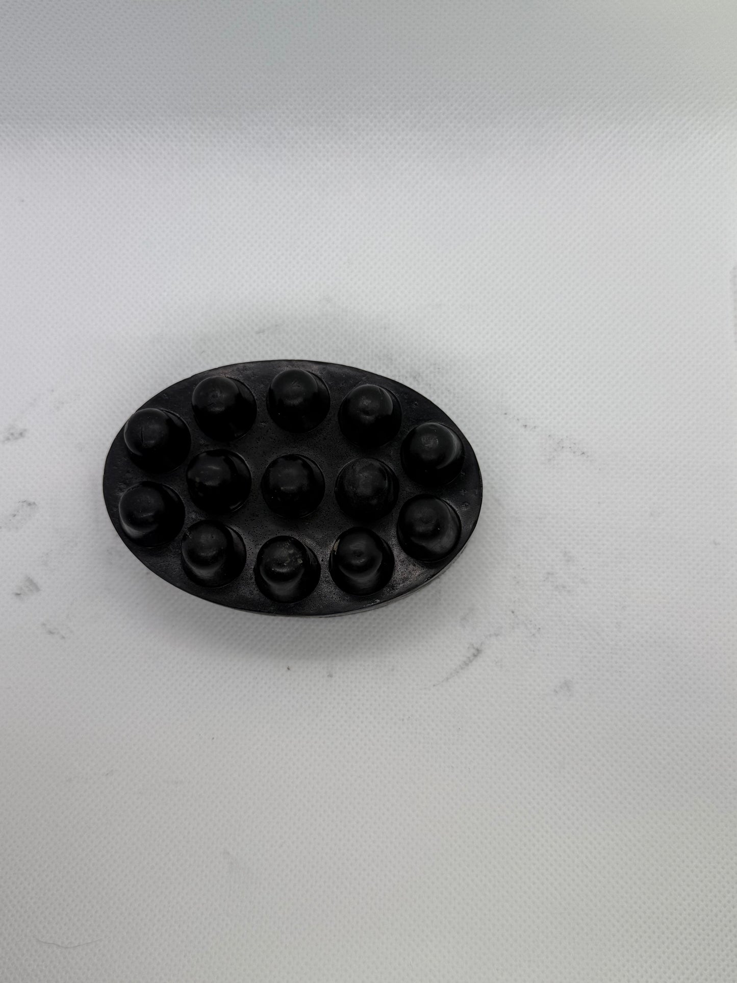 Exfoliating soap bar with a sandalwood scent