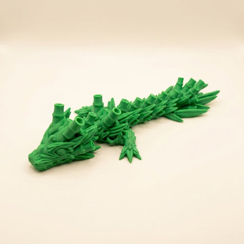 Articulated 3D printed bamboo dragon desk toy in a posed curve