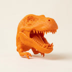 3D printed T-Rex holder with a game controller and headset mounted on it